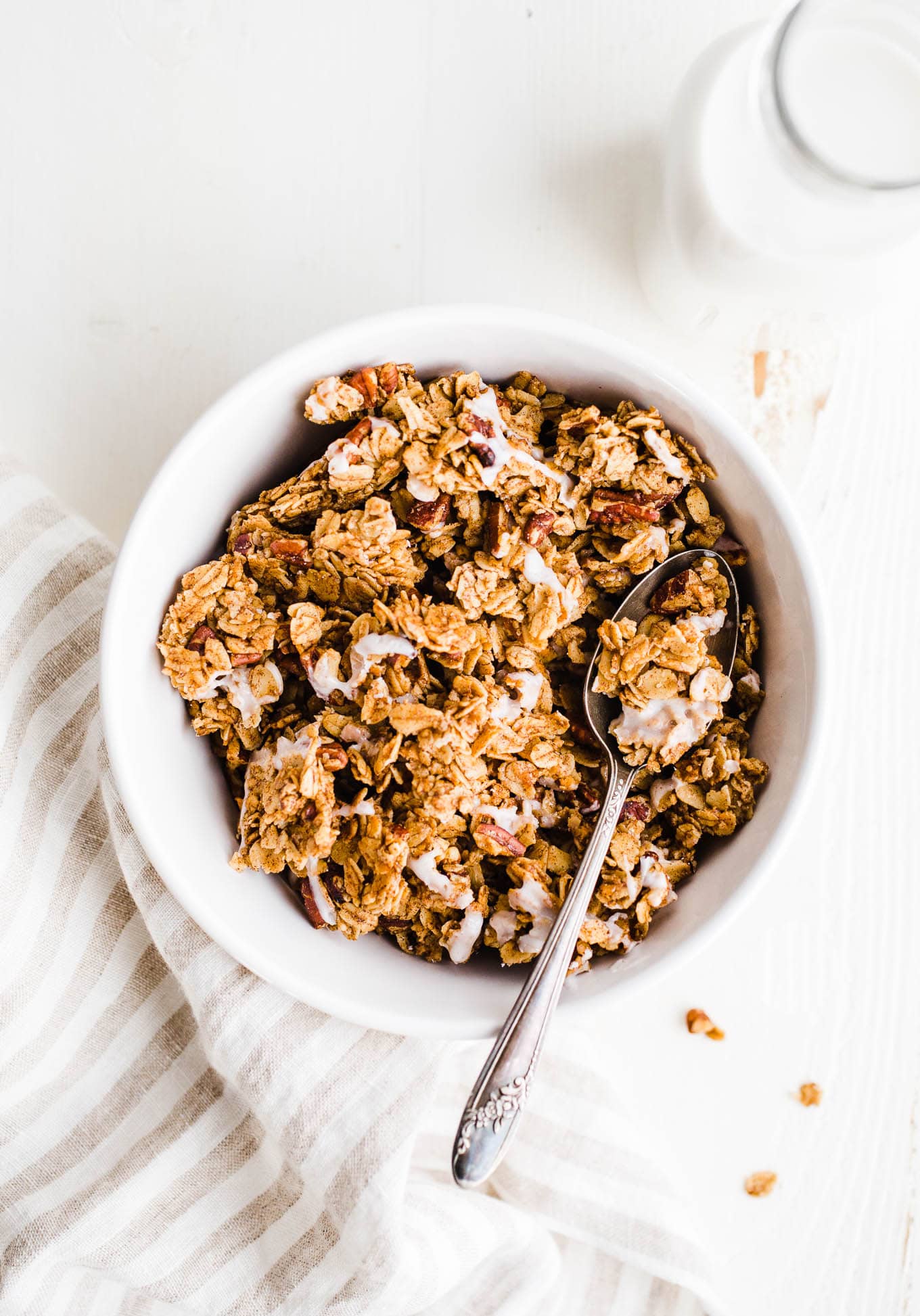 granola in a bowl with spoon.