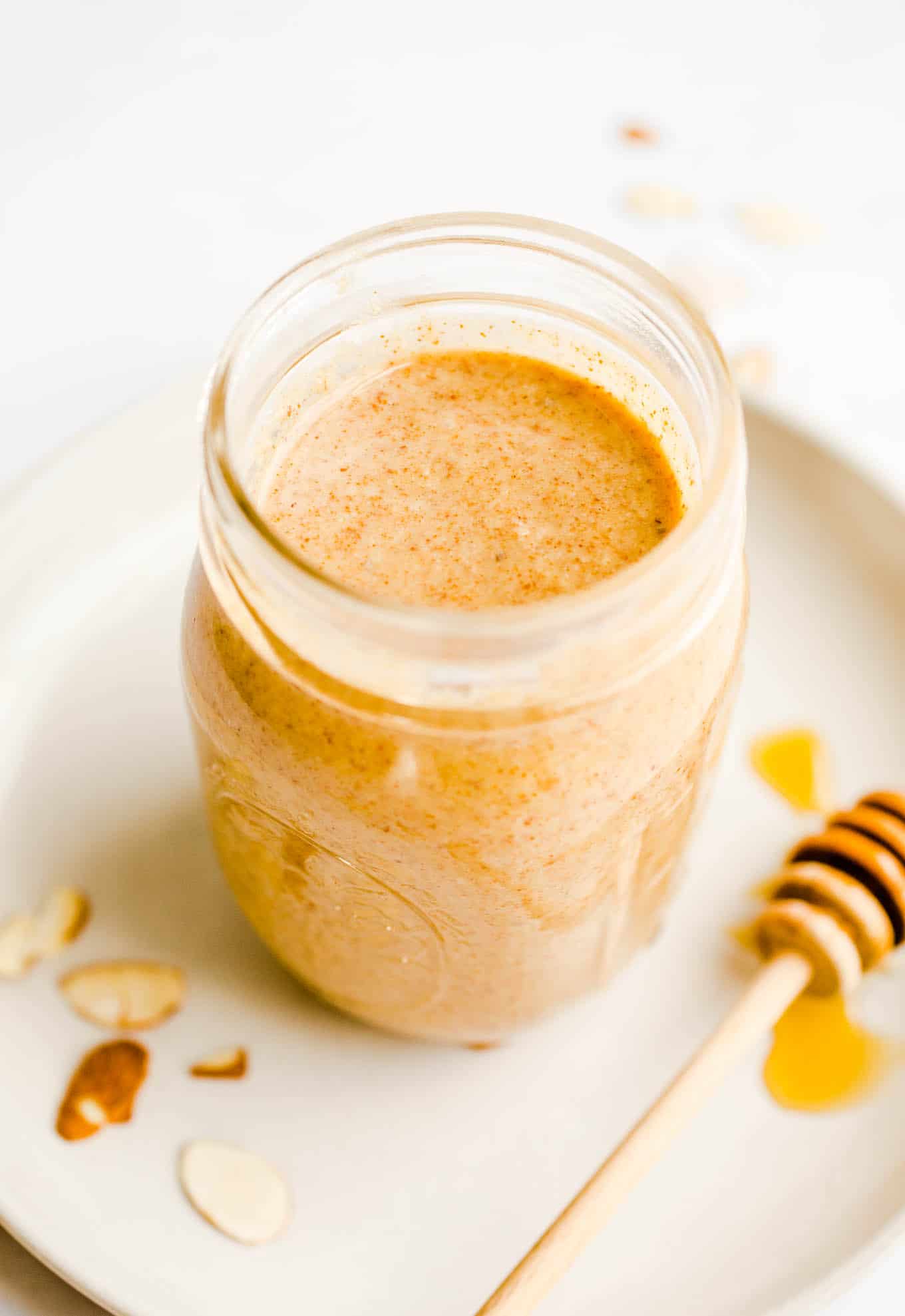 Almond butter in a glass mason jar.