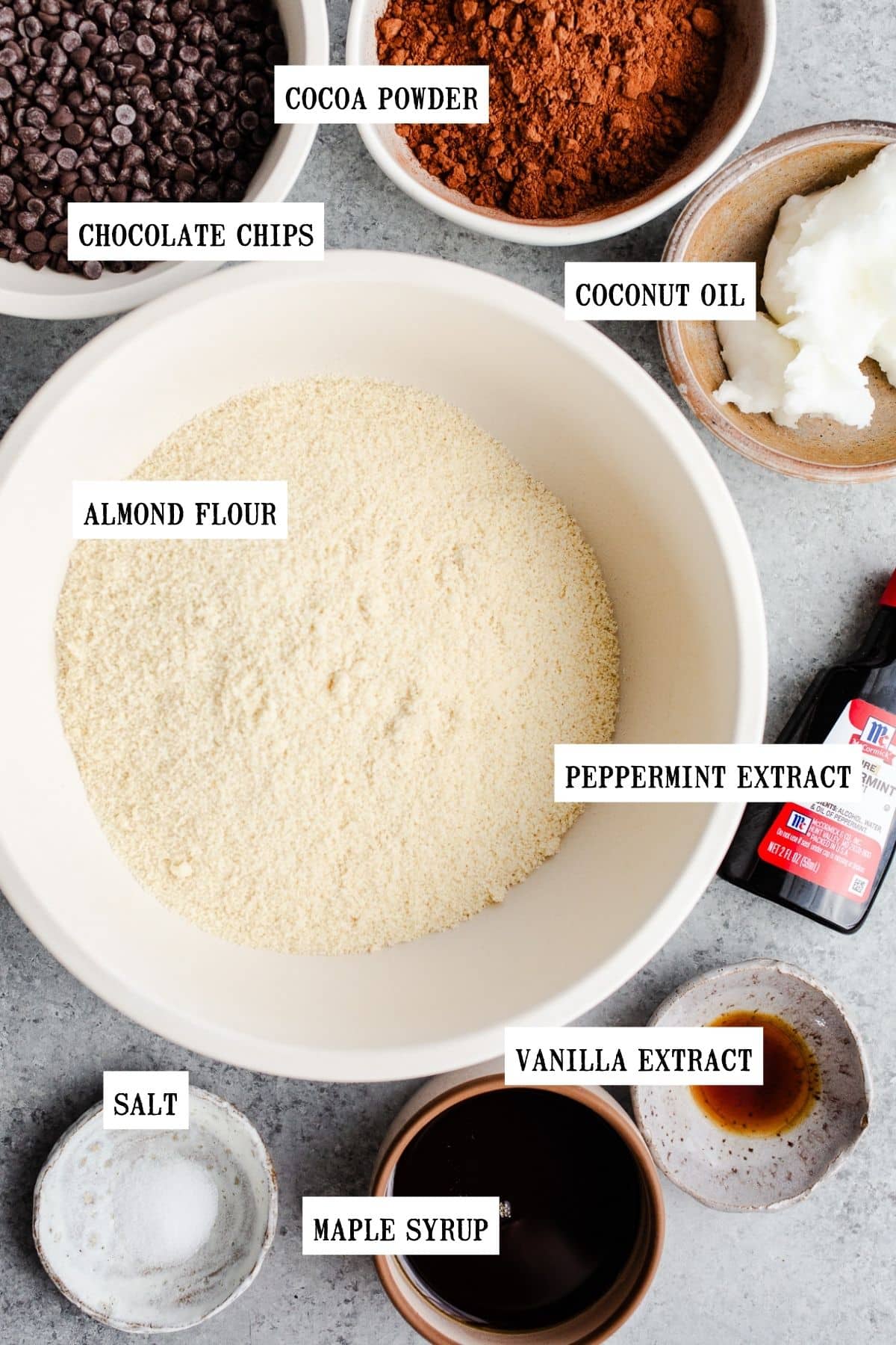 Ingredients to make chocolate cookies in bowls. 