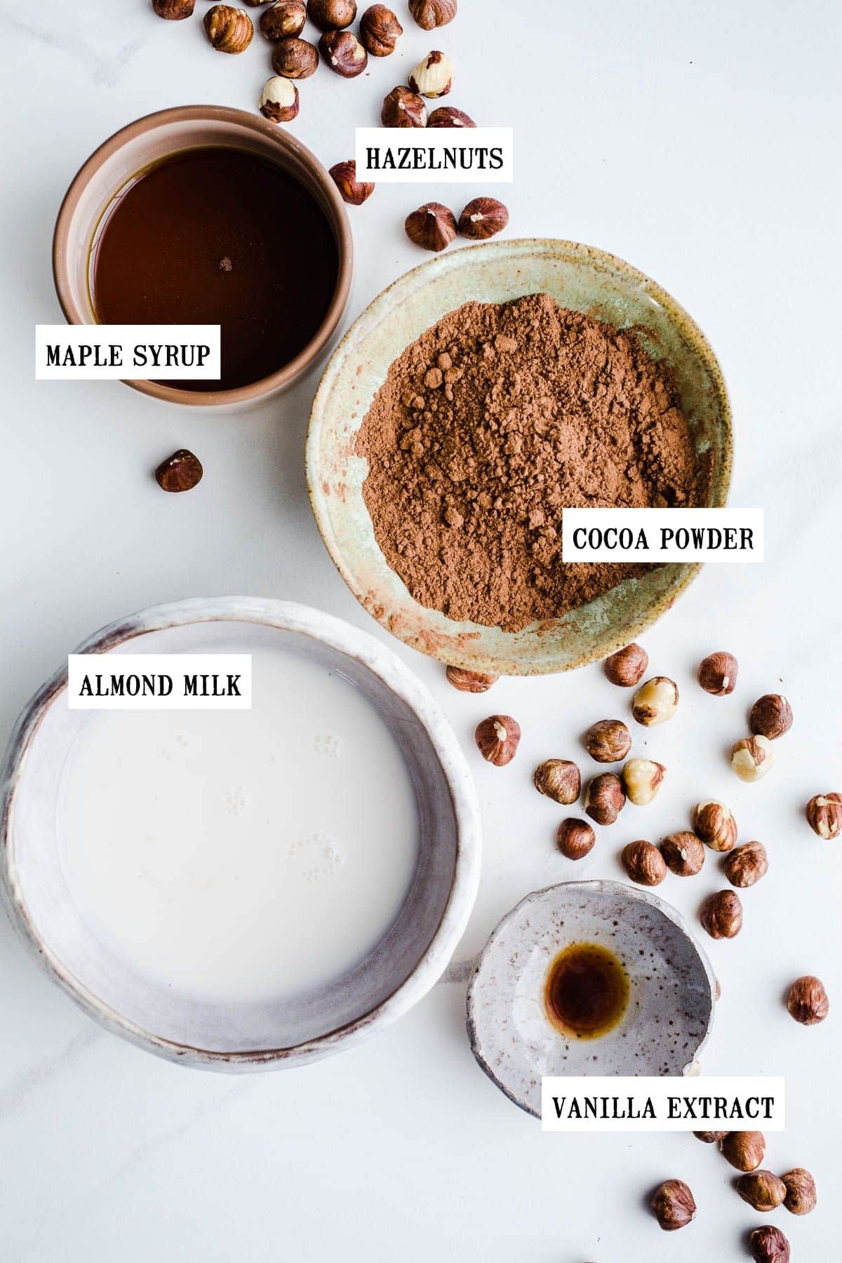 Ingredients in small bowls to make hazelnut butter.