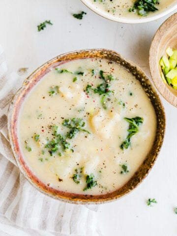 potato soup in bowl with kale