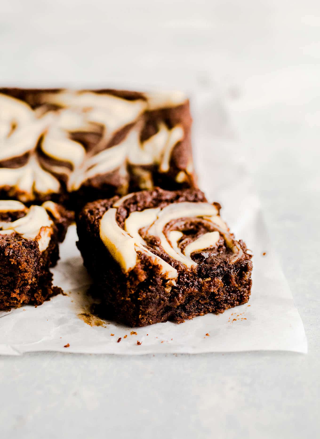cream cheese brownies on parchment paper
