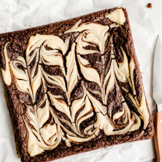 cream cheese swirl brownies on parchment paper