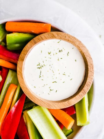 ranch dressing in a bowl with vegetables