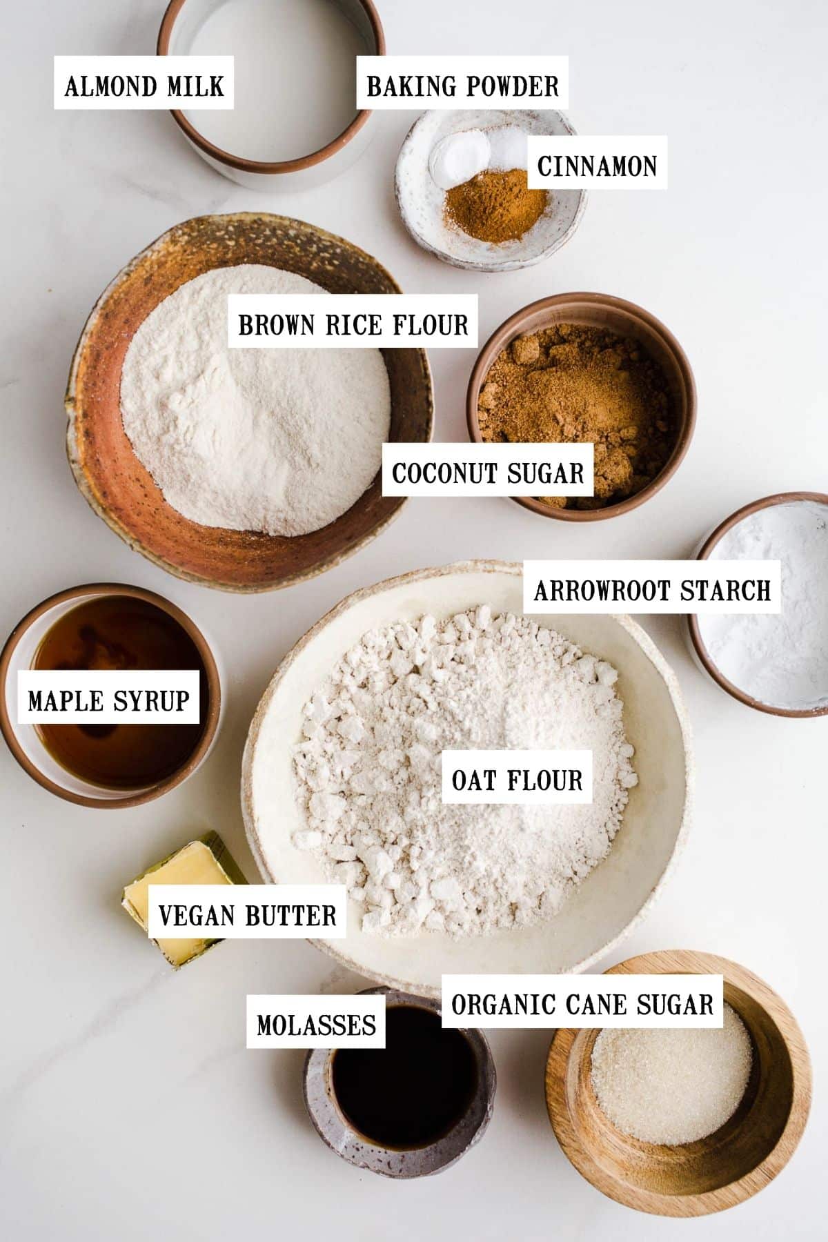 Ingredients to make graham crackers in small bowls.