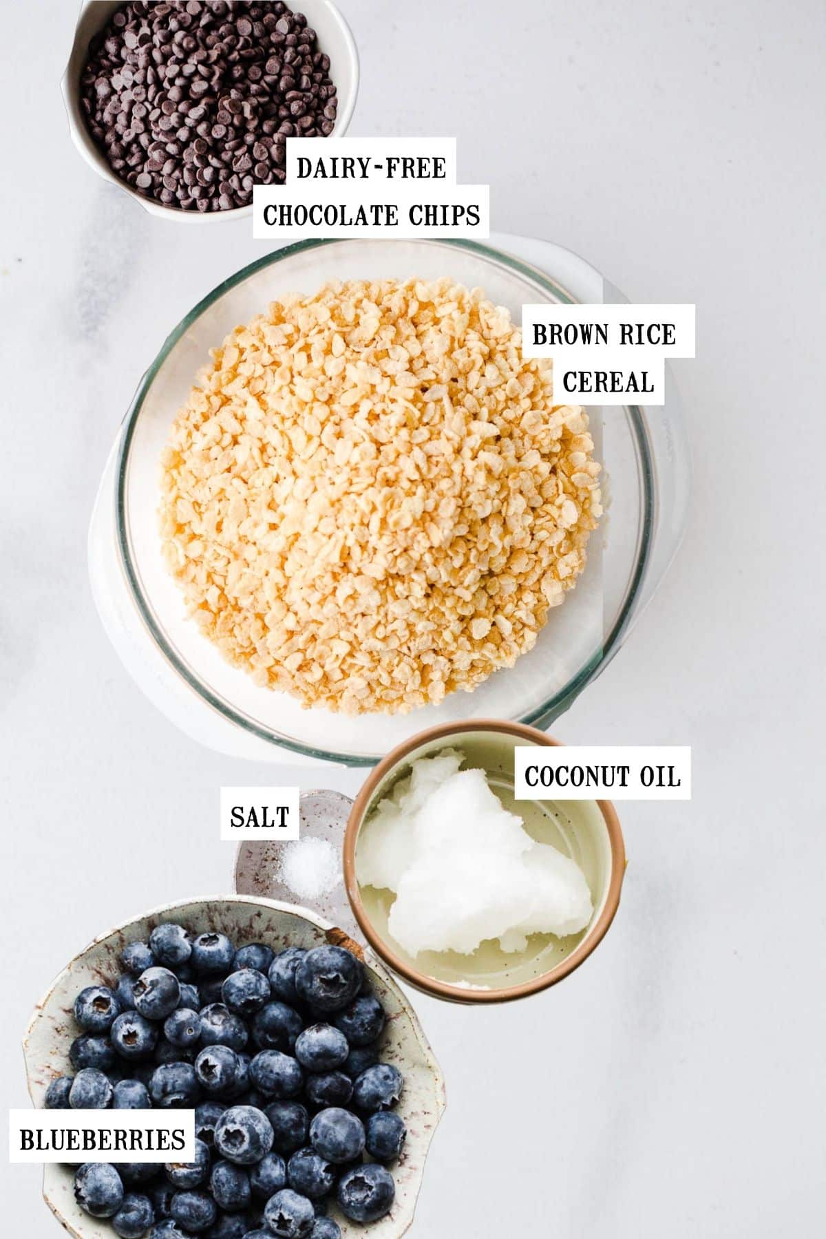 Ingredients to make chocolate clusters in small bowls. 