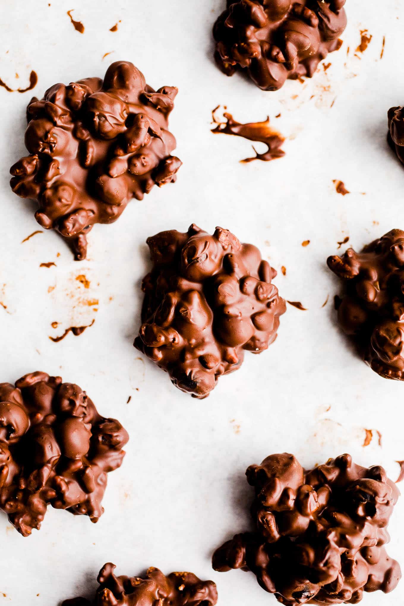 Chocolate clusters on a piece of parchment paper.