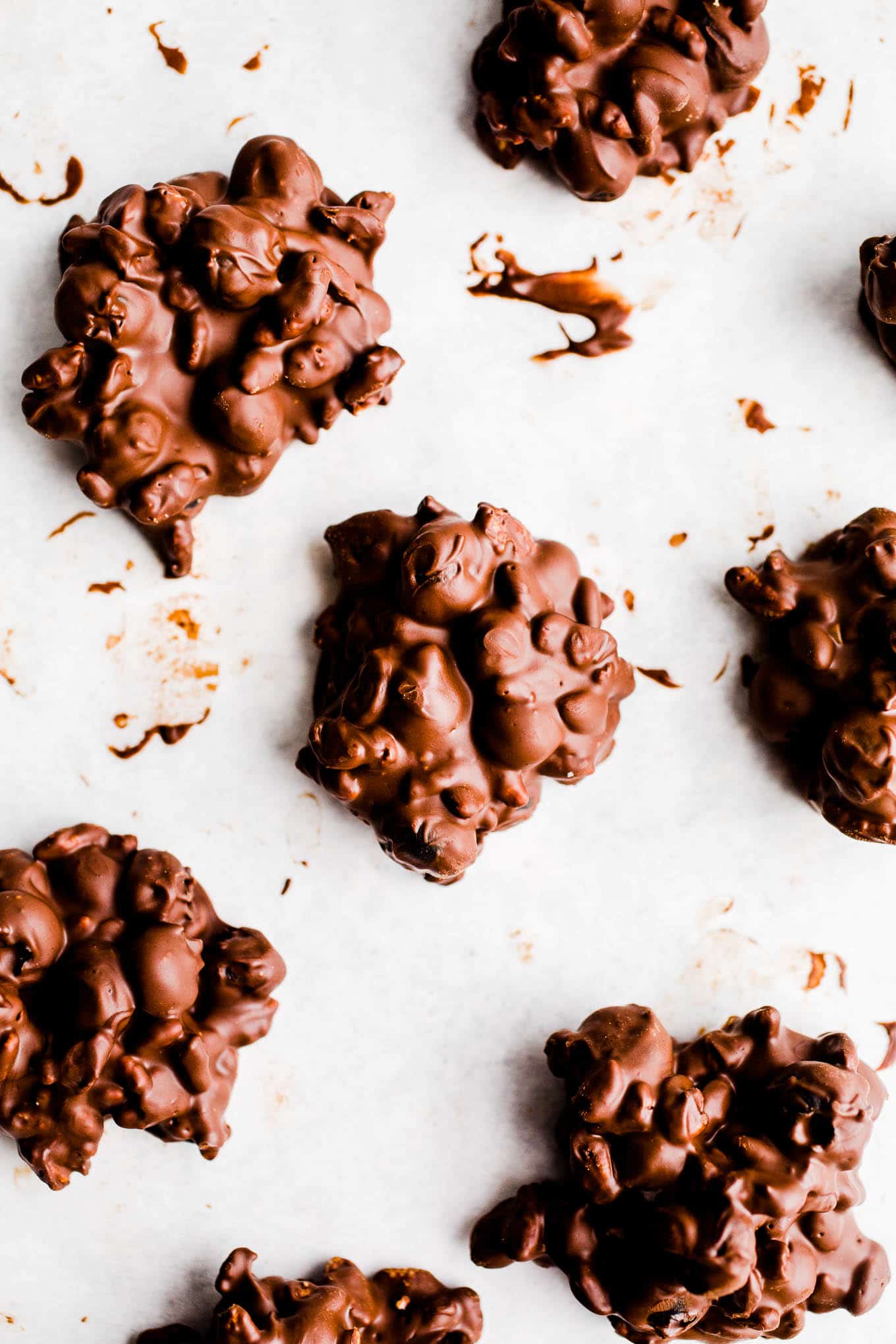 Chocolate blueberry clusters on parchment paper. 