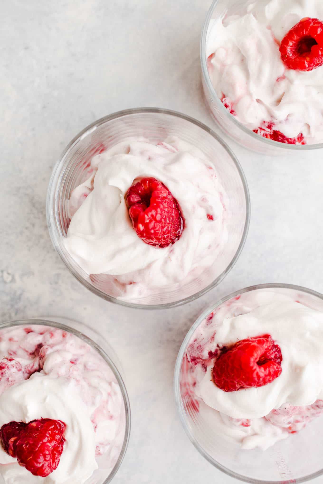 Coconut whipped cream and raspberries