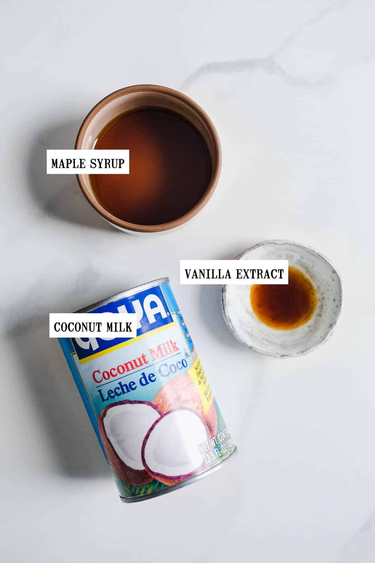 Ingredients to make dairy-free whipped topping on a marble surface.