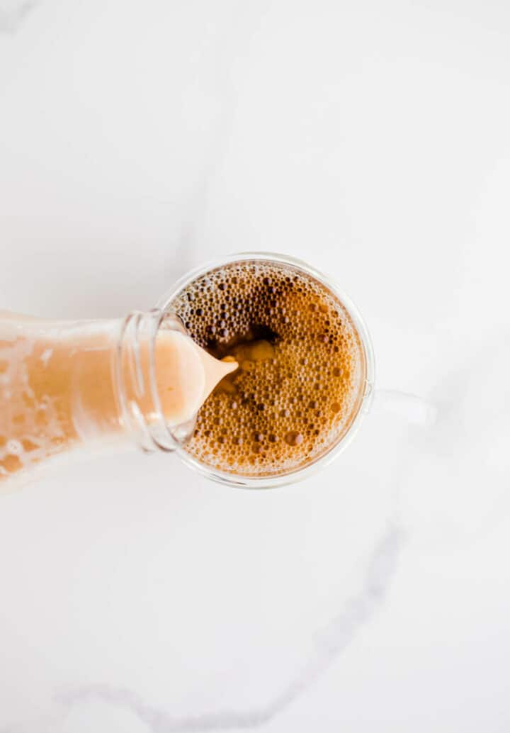 dairy-free pumpkin spice creamer in a cup of coffee