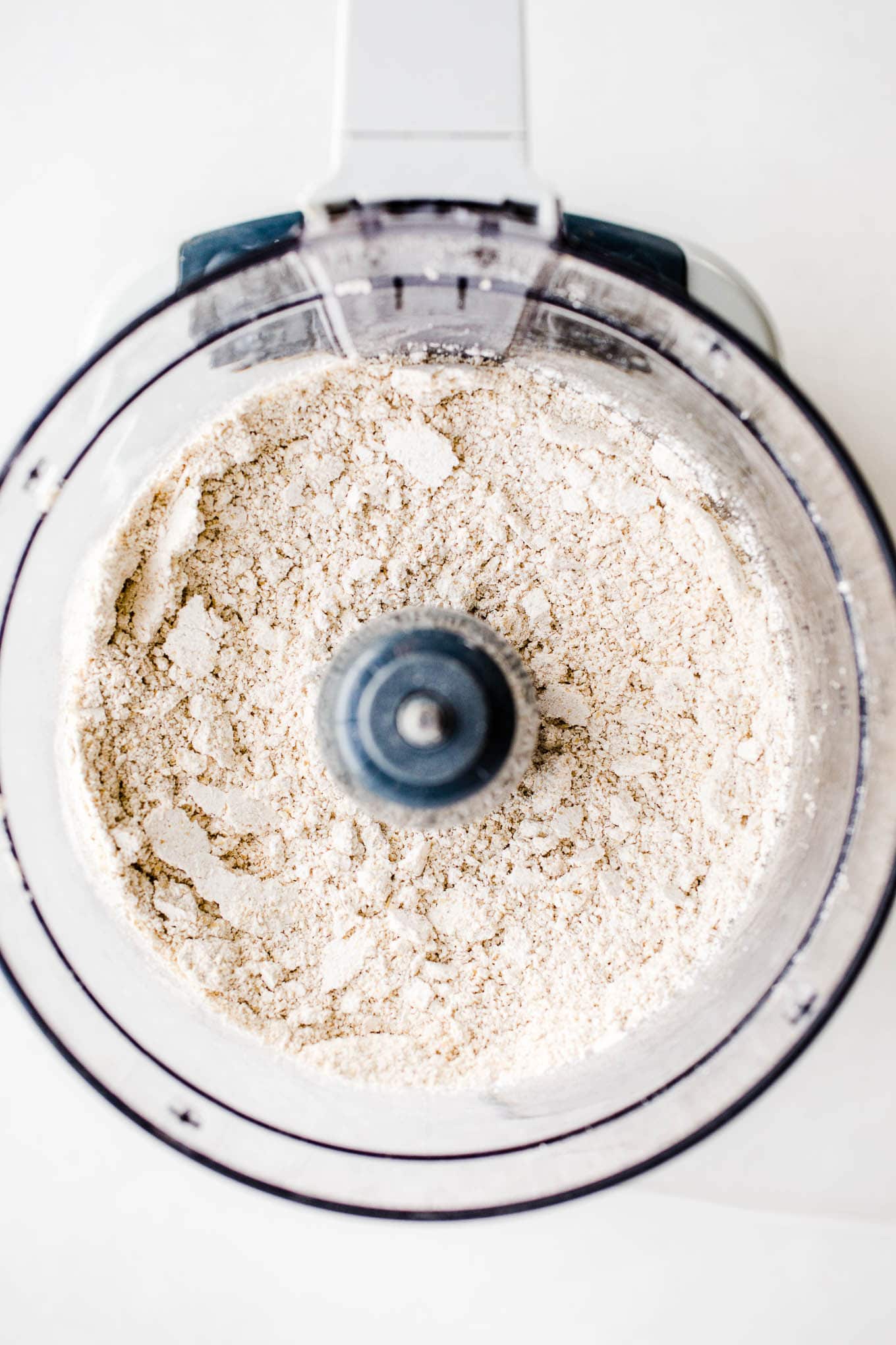 Flour in the bowl of a food processor.