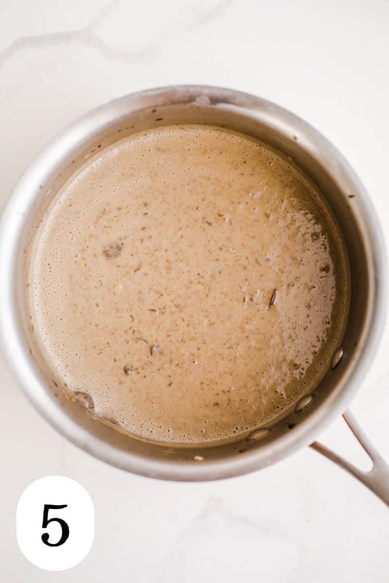 Mushroom soup in a saucepan that has been blended into a creamy consistency.