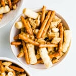snack mix in white bowls