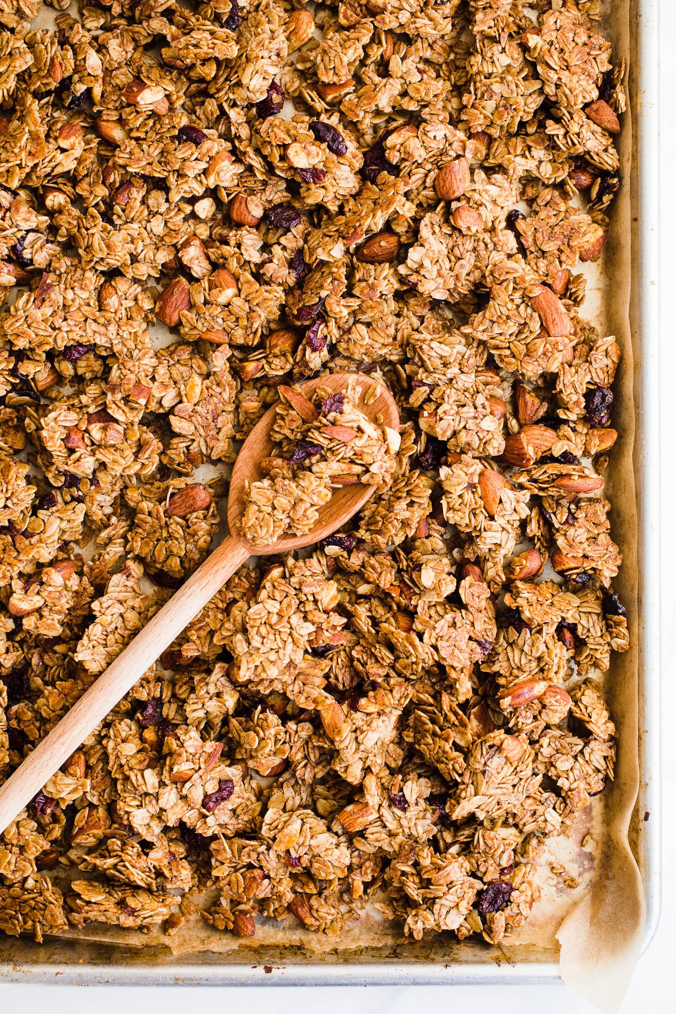 Clusters of granola on a sheet pan.