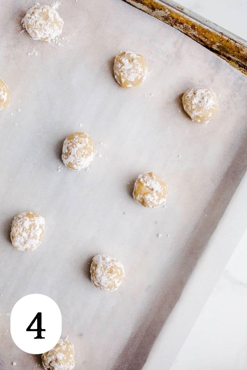 Lemon cookie dough balls on a baking sheet.