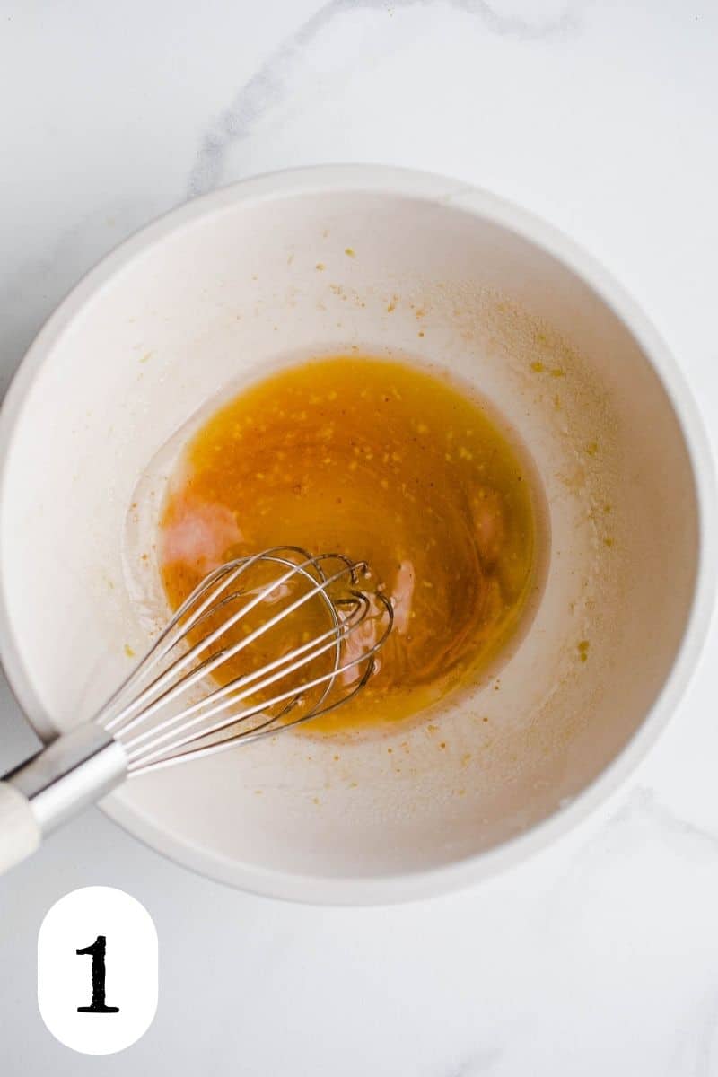 Maple syrup and sugar in a mixing bowl. 