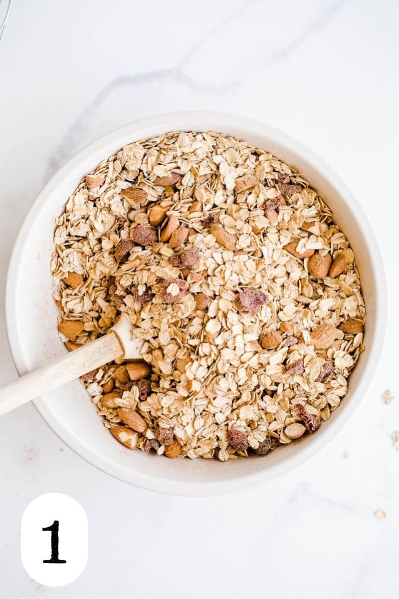 Oats and almonds in a mixing bowl. 