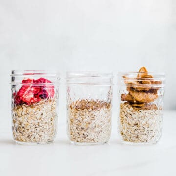 Instant oatmeal in glass jars with dried fruit topping.