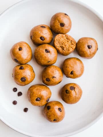 Almond butter balls on a white plate