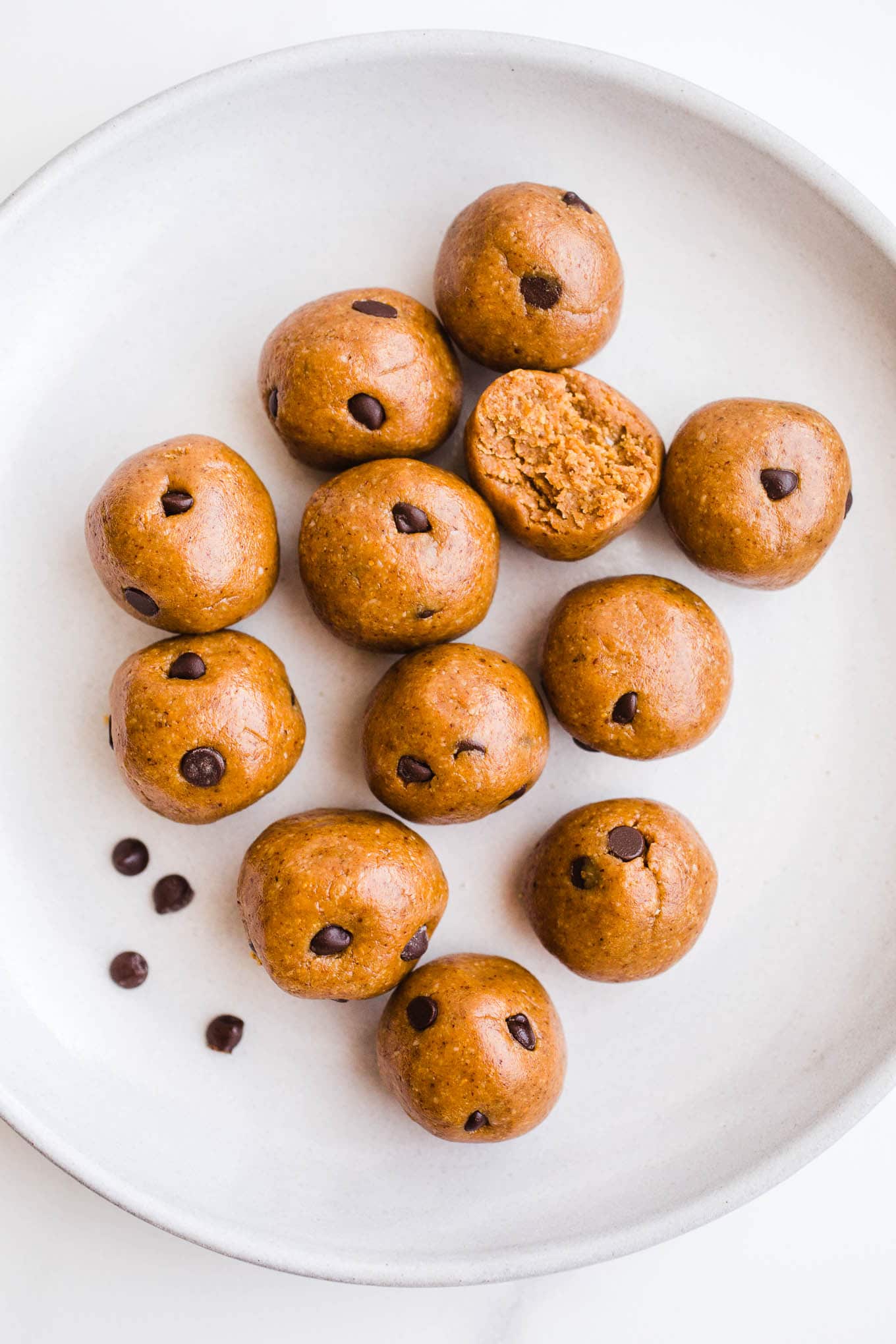 Almond butter balls on a white plate