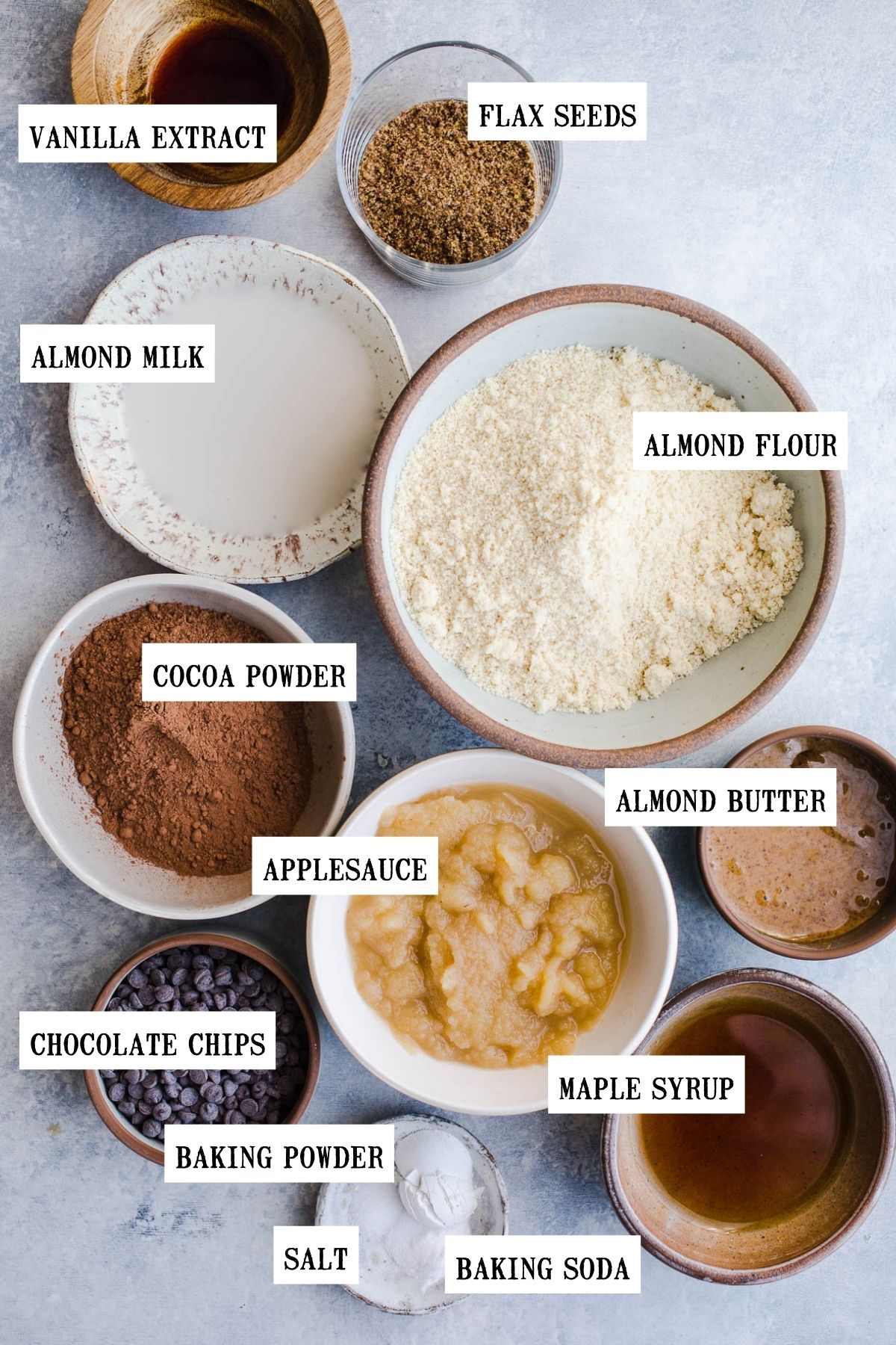 Ingredients to make a chocolate loaf in small bowls.