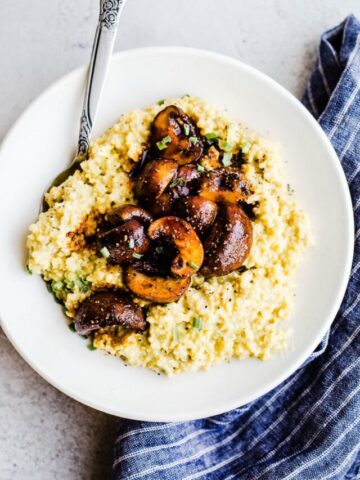 Millet grits and mushrooms in a bowl.