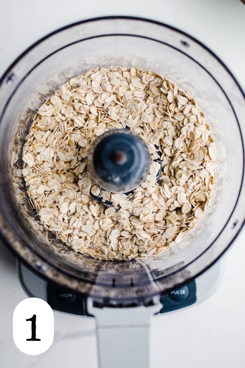 Whole grain oats in the bowl of a food processor.