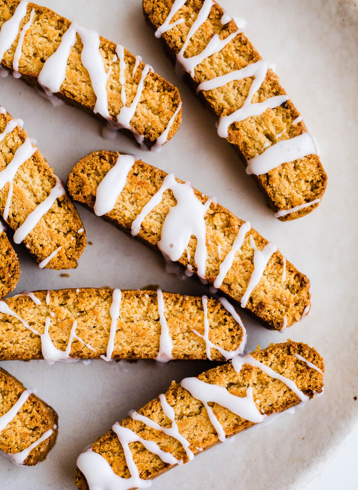 Golden baked biscotti with lemon glaze on top.
