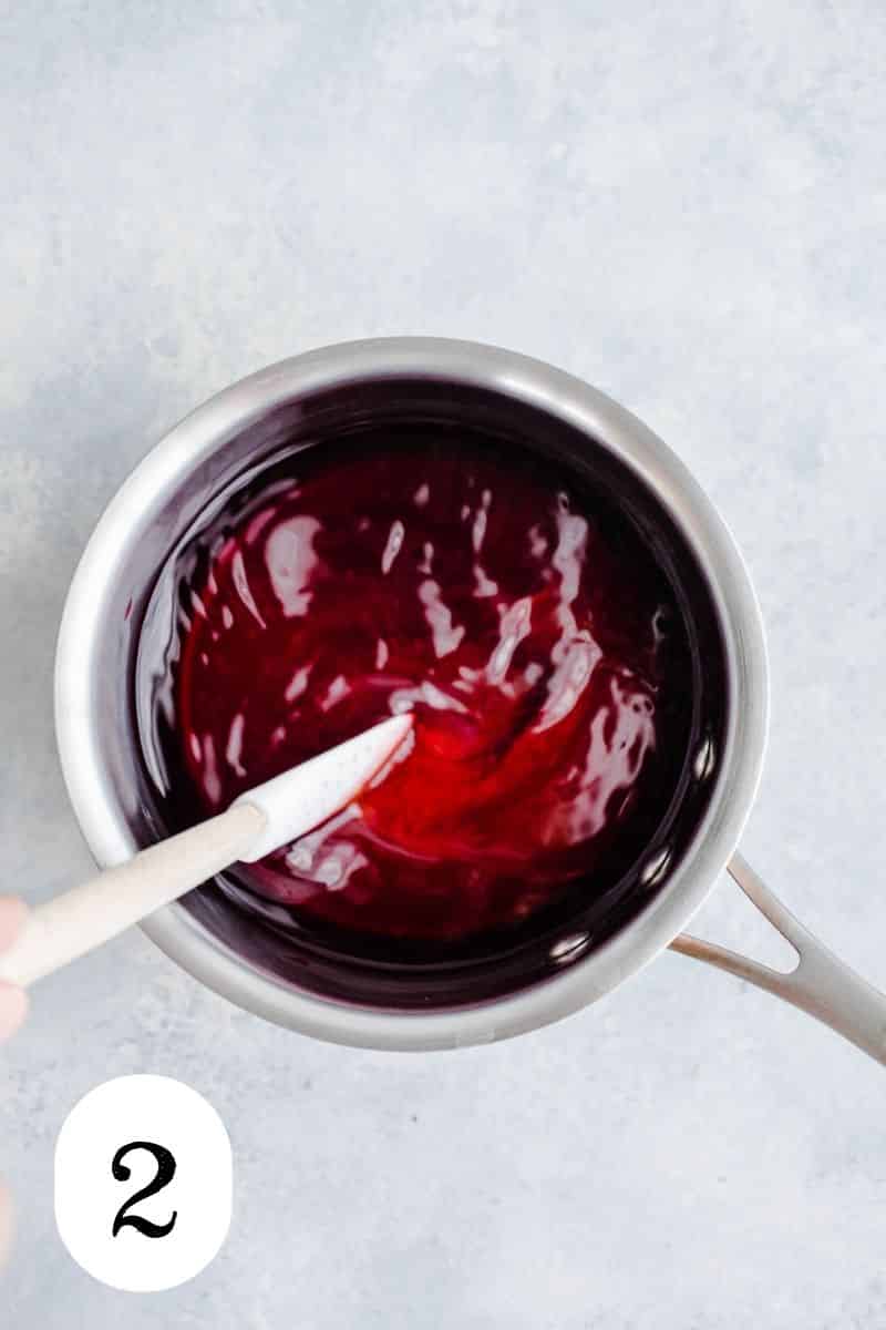 Honey and hibiscus tea in a small saucepan.