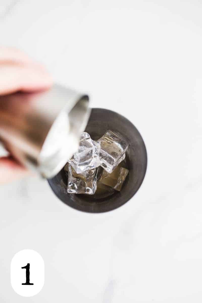 Ice and agave nectar in a silver cocktail shaker.