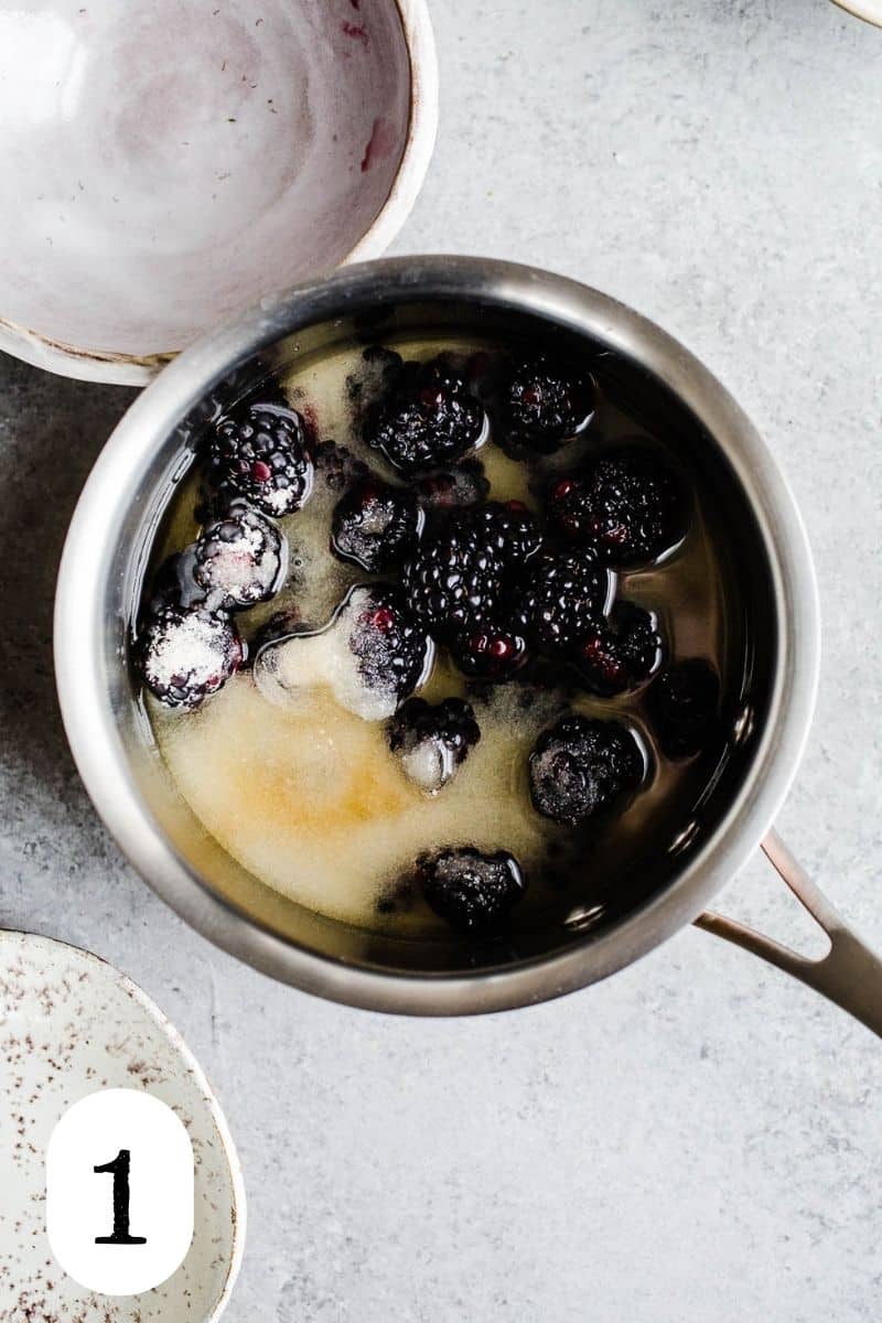 Sugar, fresh blackberries, and water in a saucepan.