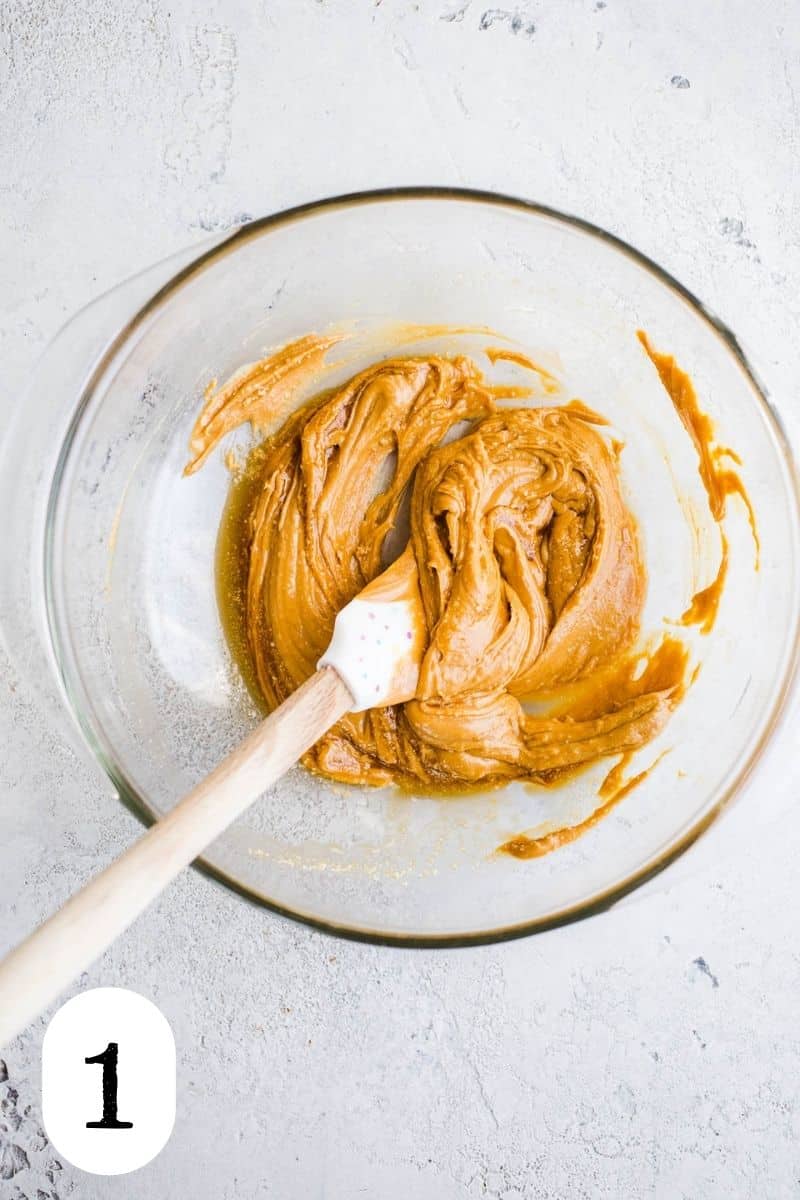 Peanut butter and almond flour in a glass bowl.