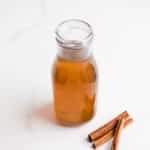 Cinnamon simple syrup in a glass jar.