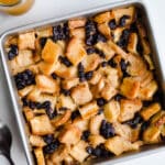Baked bread pudding in a square pan.