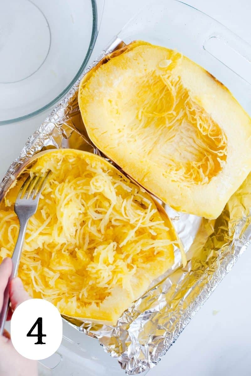 Squash half that has been shredded into noodles.