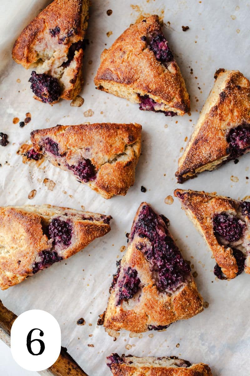 Baked scones on parchment paper.