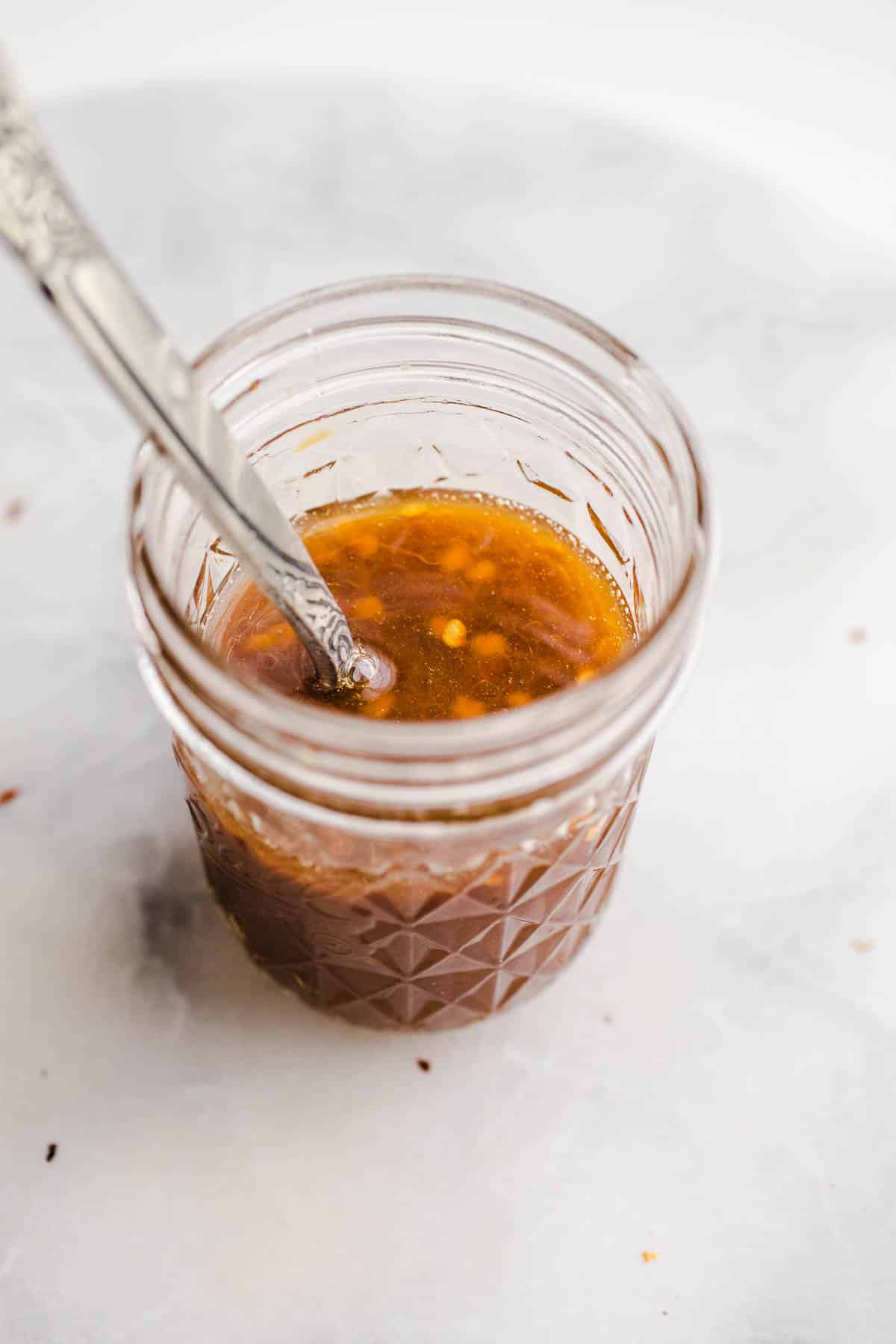 A mason jar with tamari sauce.