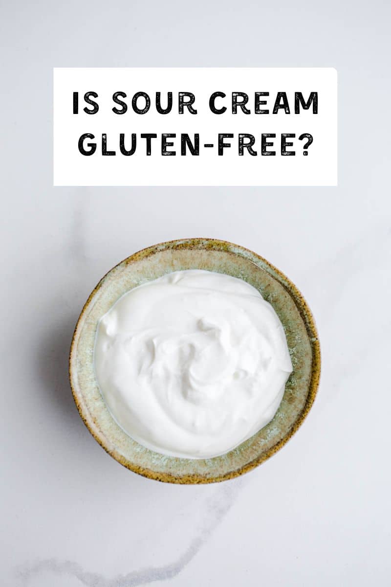 A bowl of sour cream on a marble surface. 