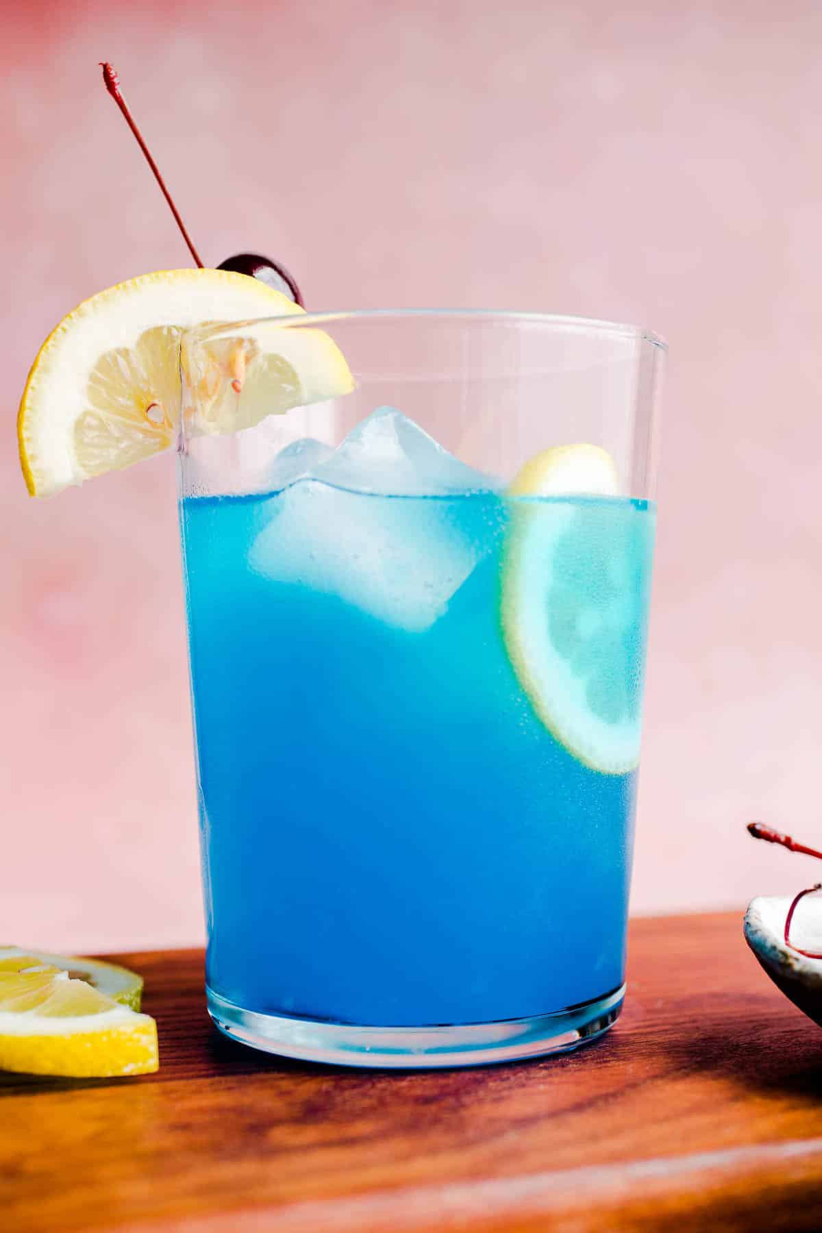 A mocktail with a lemon slice in a glass.