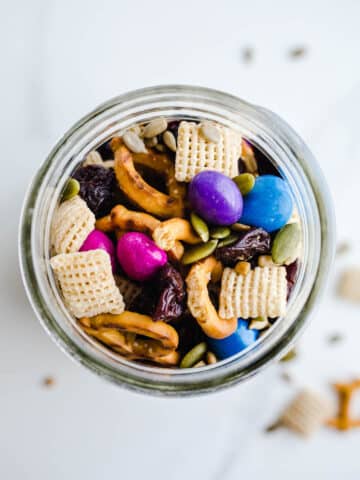 A mason jar filled with snack mix.