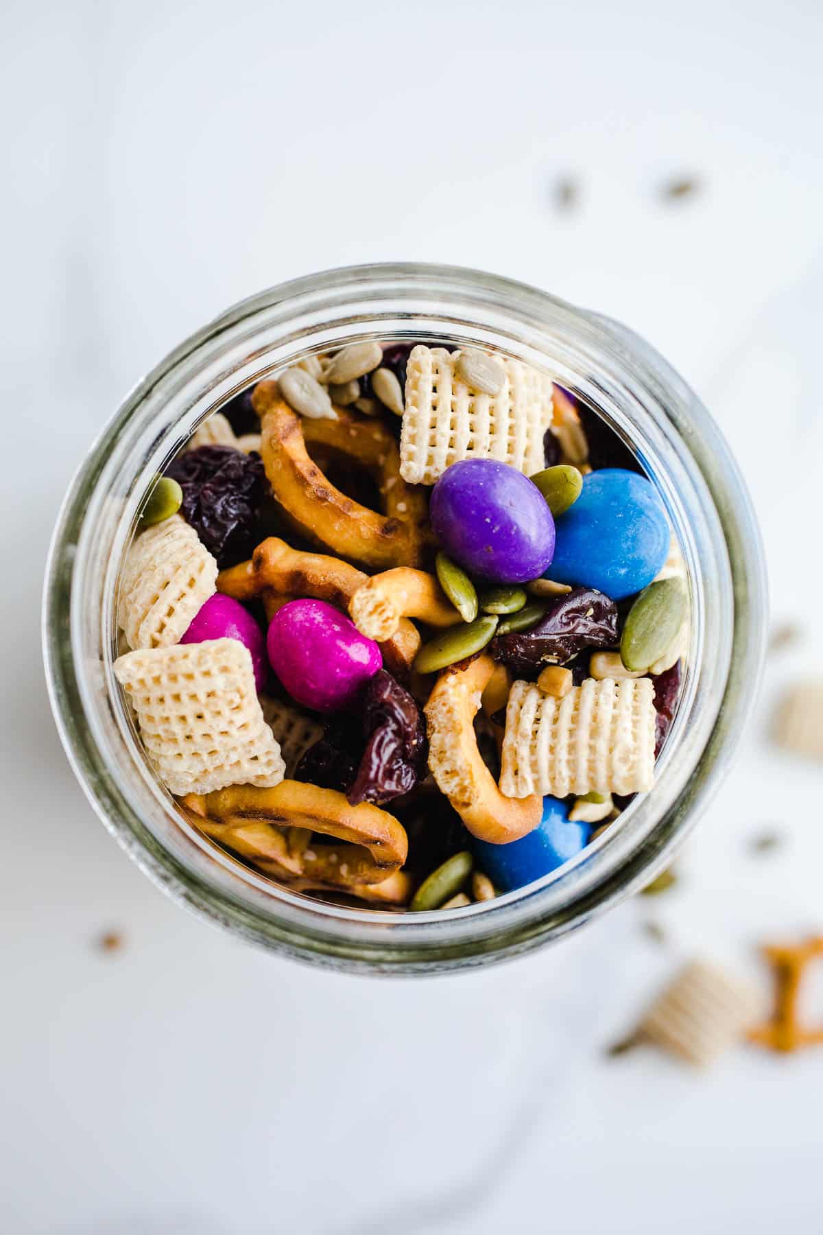 A mason jar filled with snack mix.