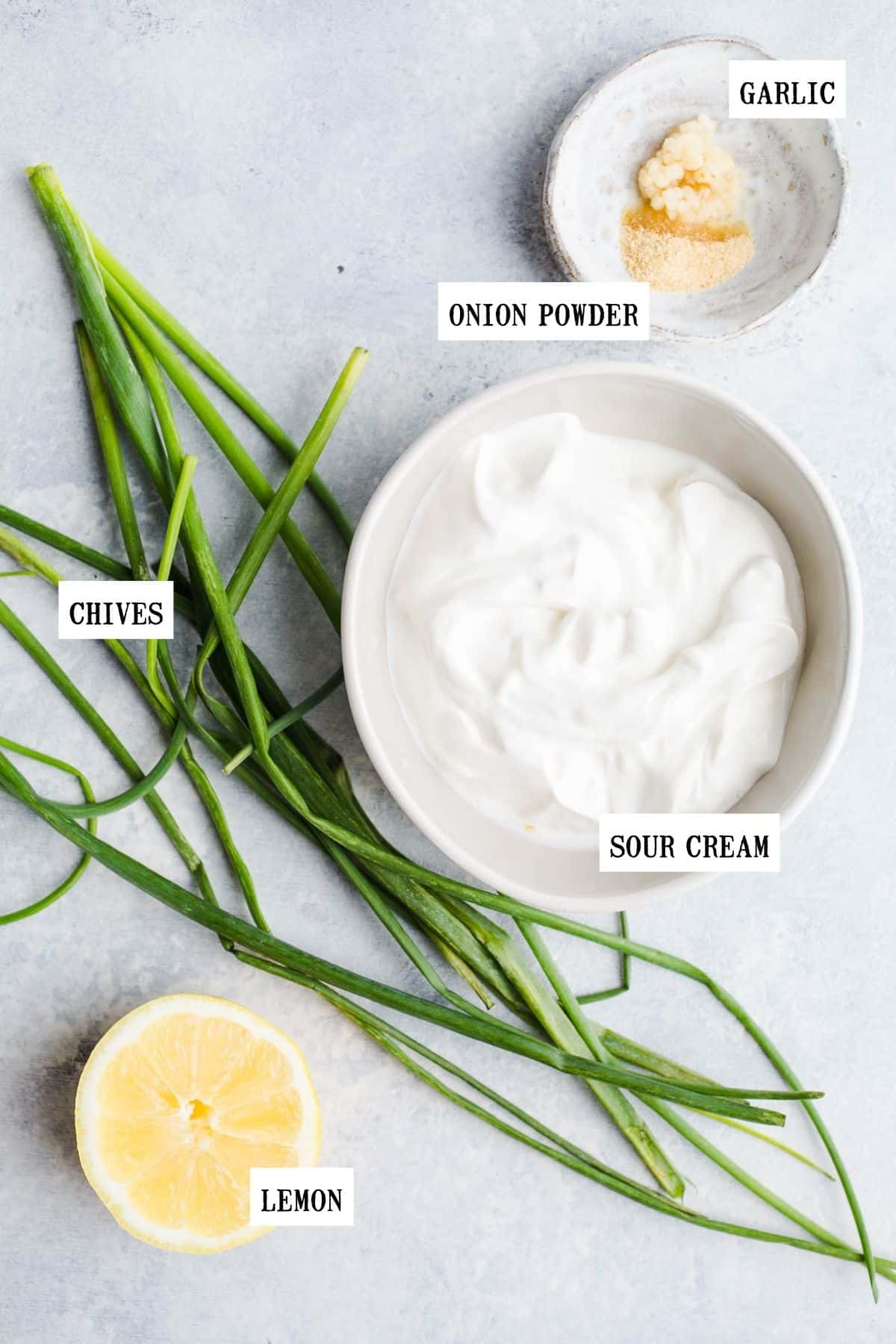 Ingredients to make a fresh dip in small bowls.