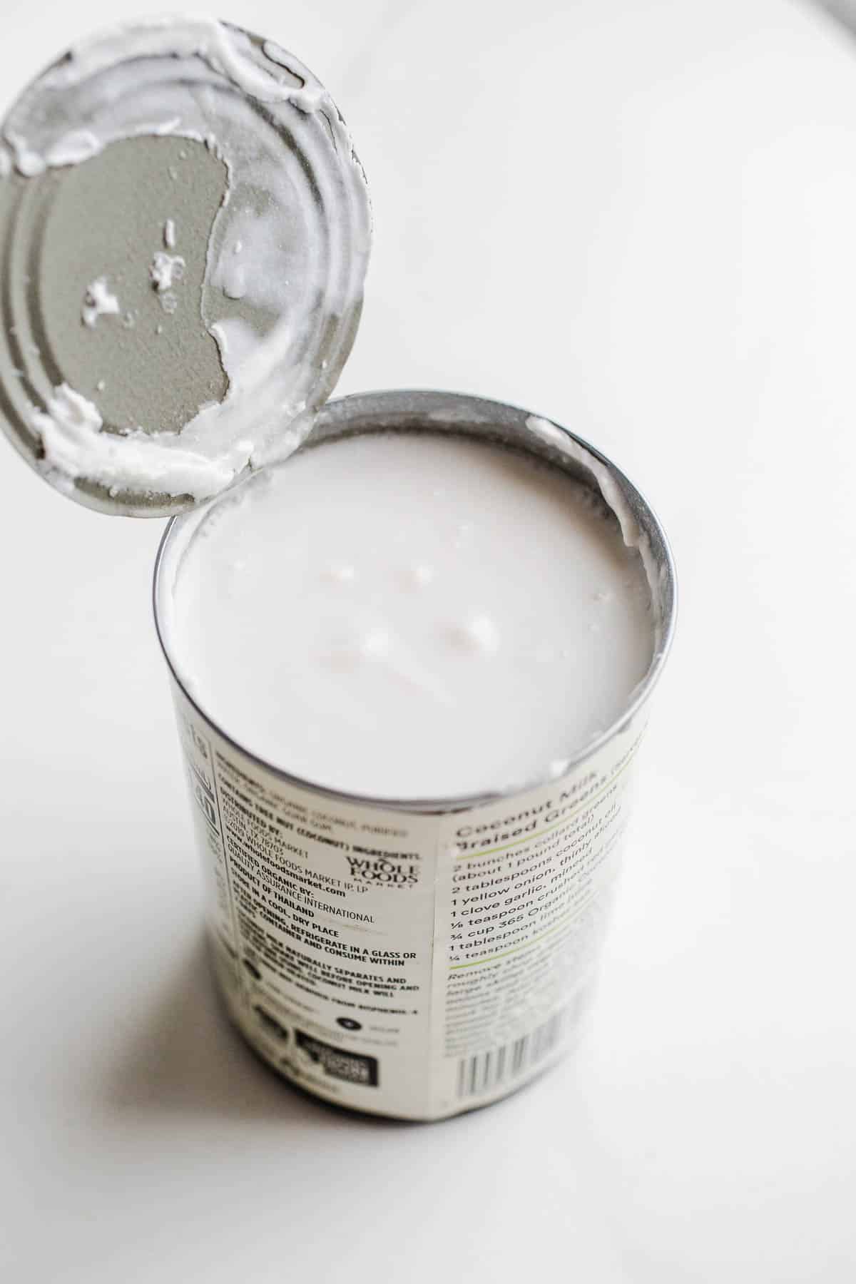 A can of milk with an open lid.