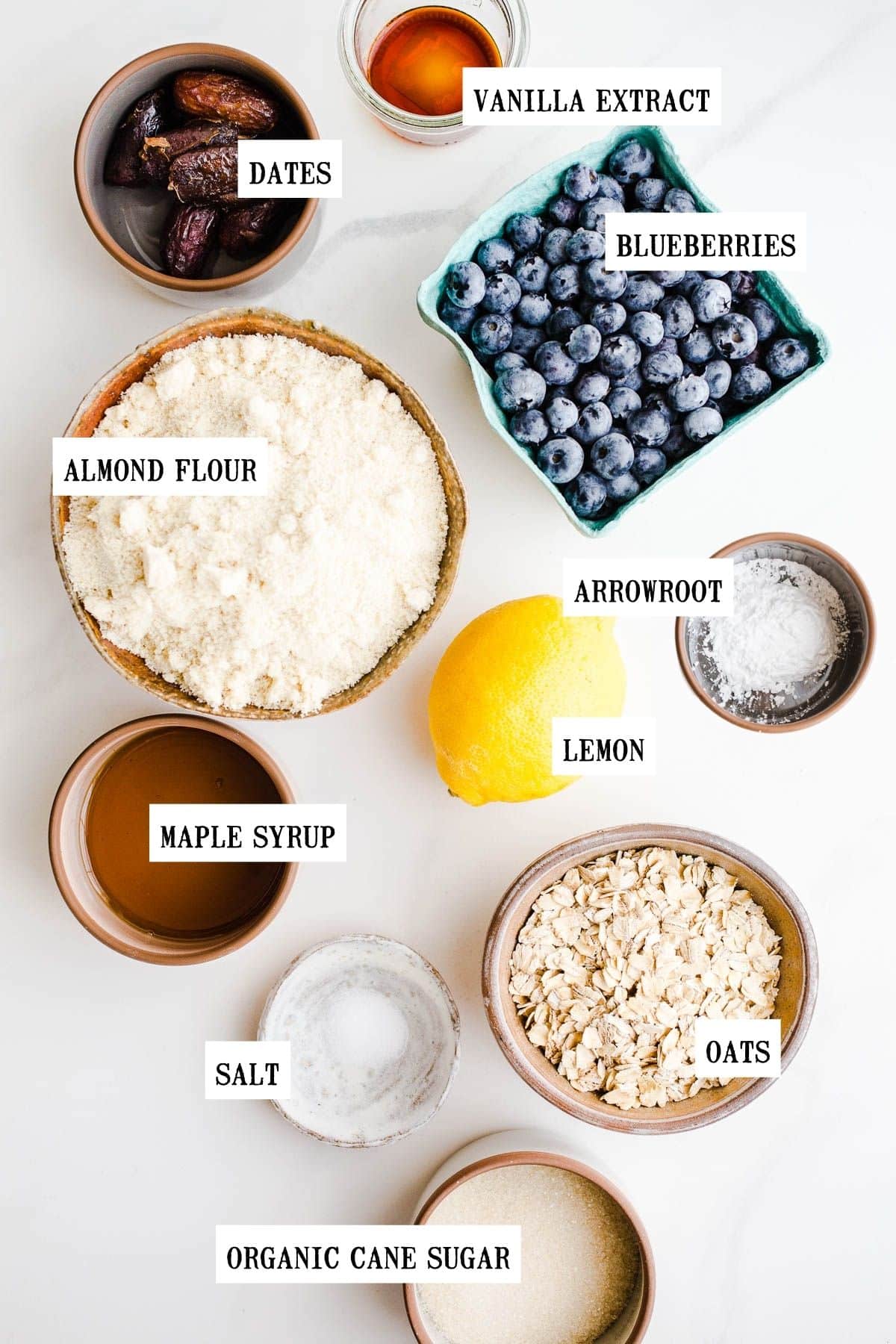 Ingredients to make a fruit tart in small bowls.