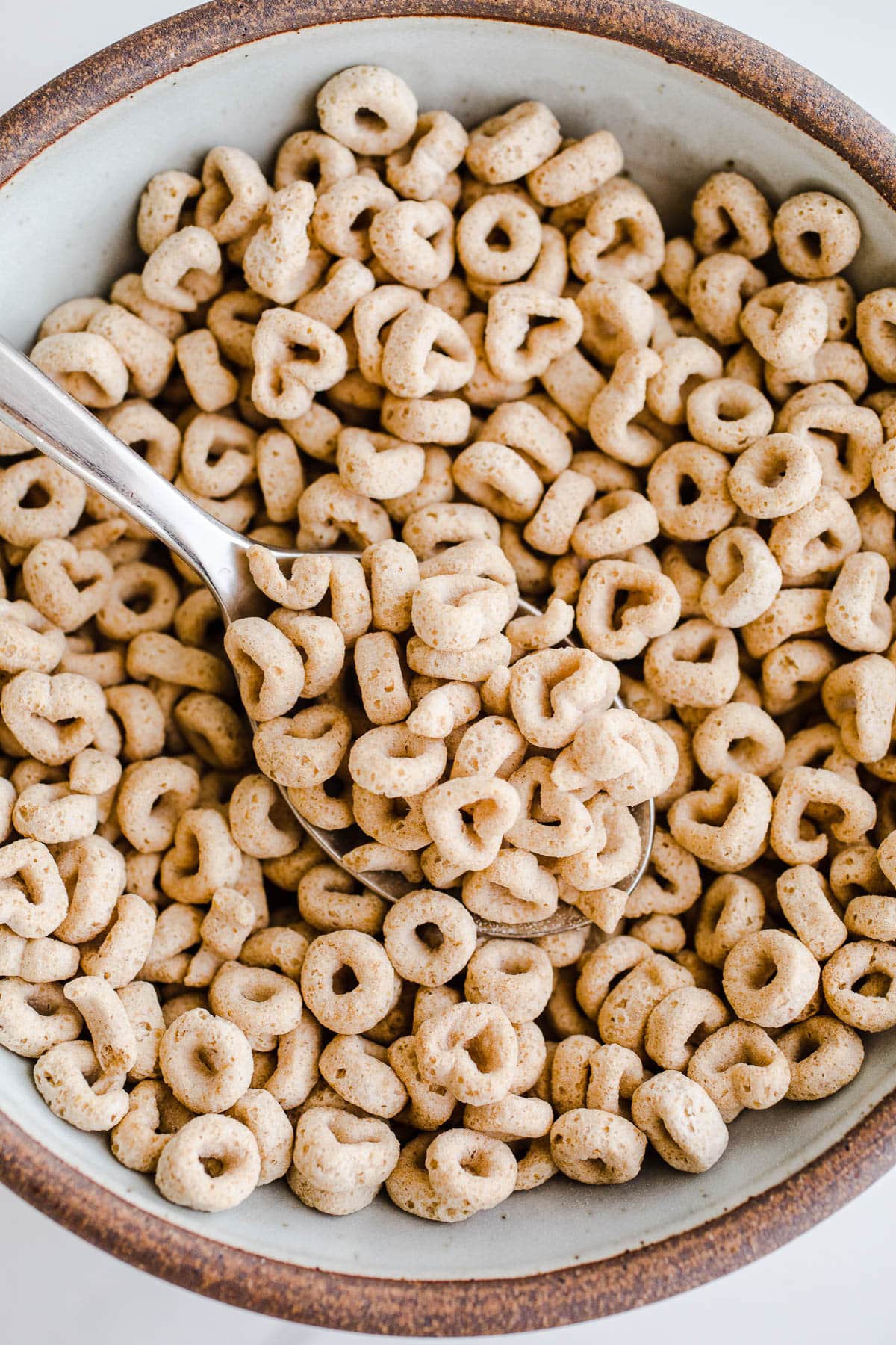 Cereal in a bowl with a spoon.