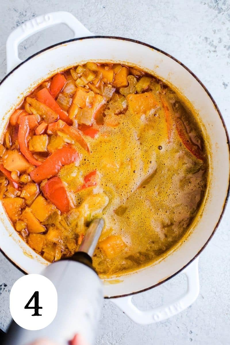Blending soup in a pot. 