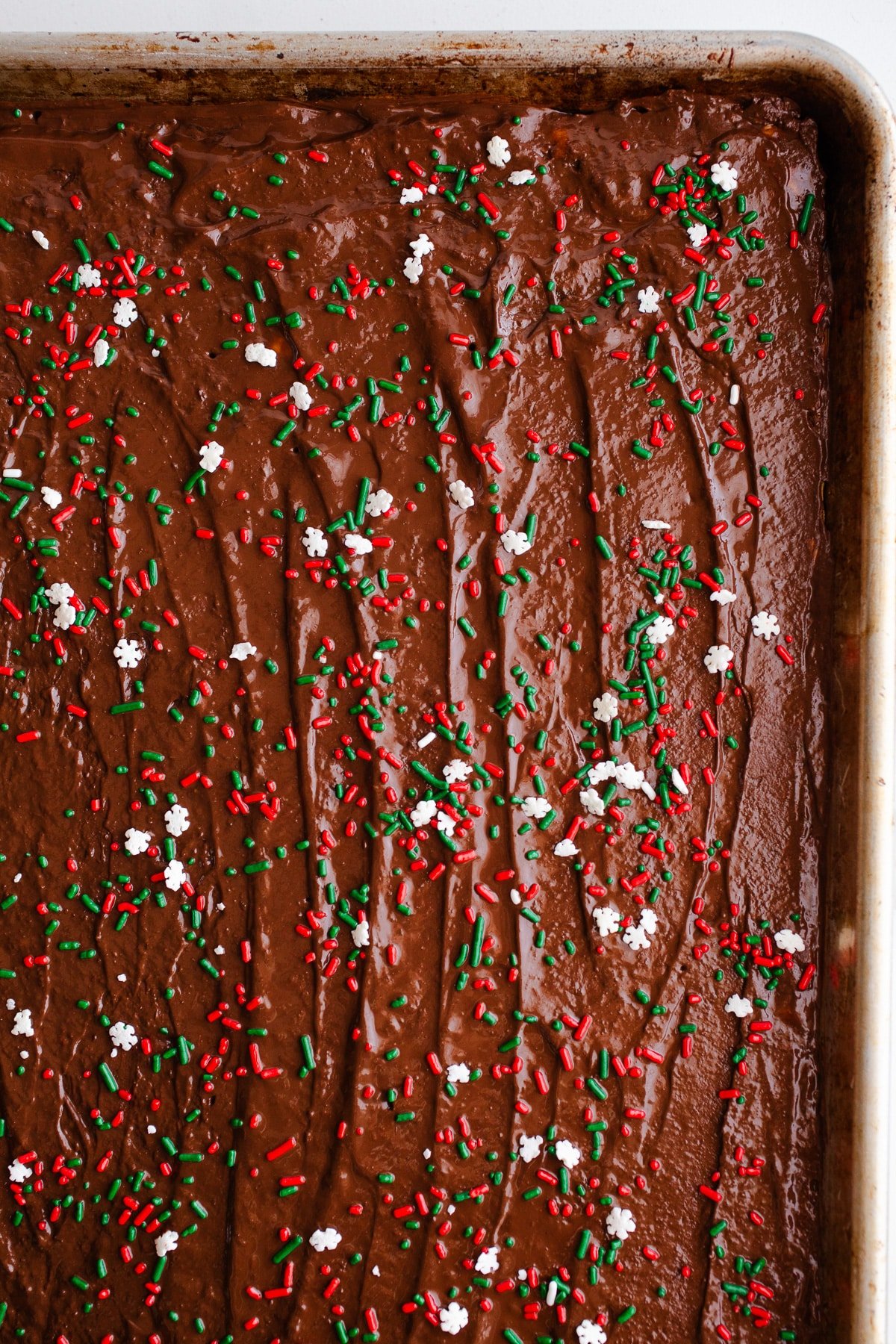Chocolate bark with sprinkles on it. 