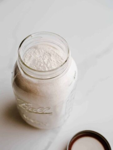 A mason jar filled with buckwheat flour.