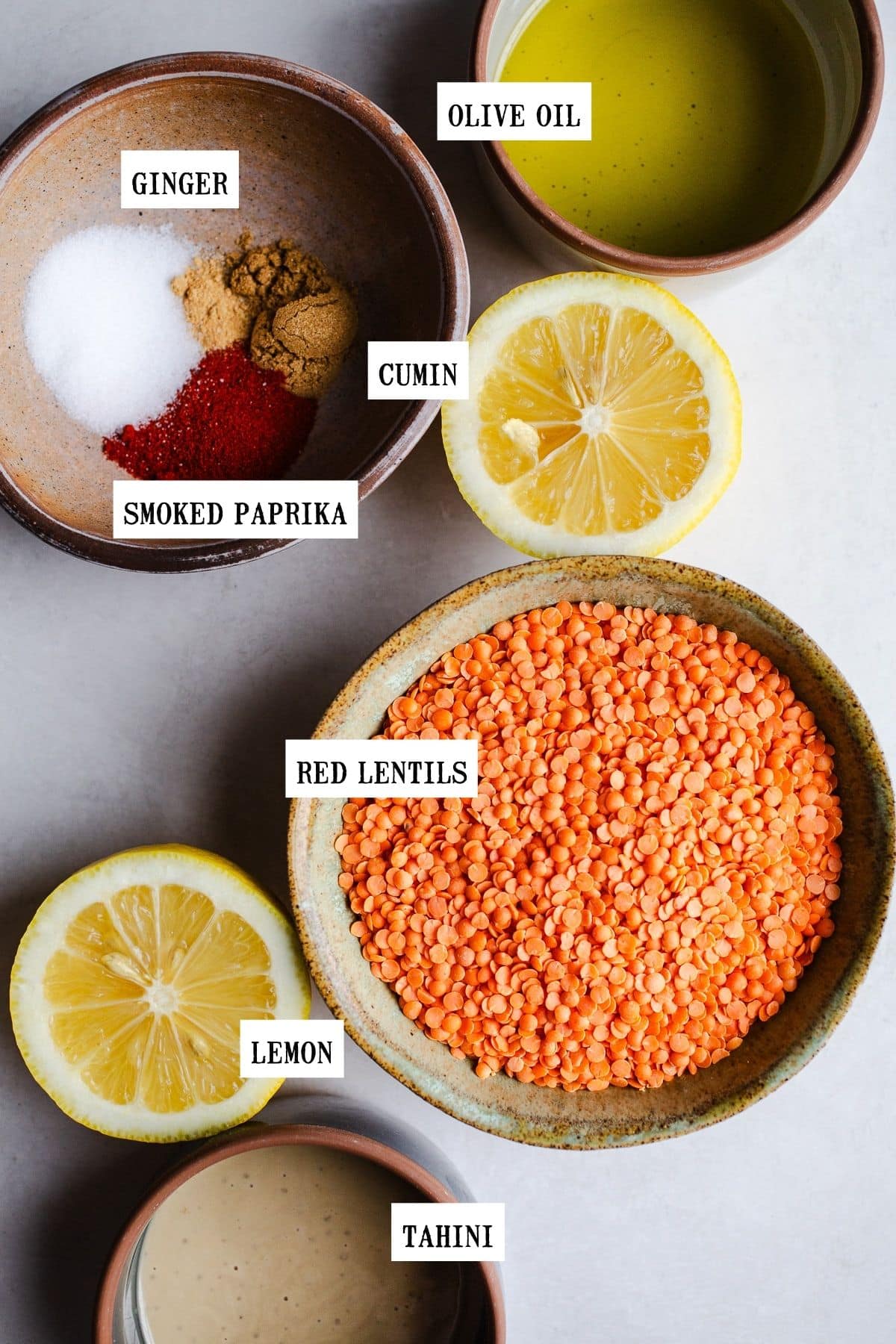 Ingredients to make lentil hummus in small bowls. 